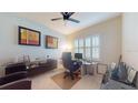 Bright office space featuring a modern desk, sleek furnishings, and shuttered windows for natural light at 5431 Hutchinson St, Port Orange, FL 32128