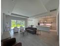 Open-concept living area featuring tile floors, modern furniture, and expansive backyard views at 1665 Lake Reserve Dr, Deland, FL 32724