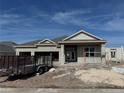 New construction home featuring stucco exterior, double-door entryway, and an attached two-car garage at 1720 Lake Reserve Dr, Deland, FL 32724