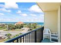 Enjoy amazing ocean views from this inviting balcony with chairs, perfect for relaxing by the beach at 1441 N Atlantic Ave # 417, Daytona Beach, FL 32118