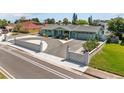 Charming single-story home with a well-manicured lawn, lovely light-blue paint, and a spacious driveway at 324 Plaza Blvd, Daytona Beach, FL 32118