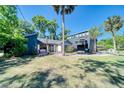 Charming home featuring lush front yard and beautiful plants at 330 Wall Ave, Ormond Beach, FL 32174