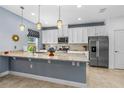 Modern kitchen with granite countertops, stainless steel appliances, and ample cabinet space at 5635 Estero Loop, Port Orange, FL 32128