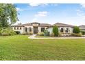 Charming single Gathering home boasting a manicured lawn and beautiful landscaping at 1357 Liam Cir, Ormond Beach, FL 32174