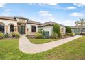 Inviting single Gathering home with a well-maintained lawn and walkway at 1357 Liam Cir, Ormond Beach, FL 32174
