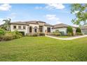 Well-maintained single Gathering home showcasing lush green lawn and decorative landscaping at 1357 Liam Cir, Ormond Beach, FL 32174