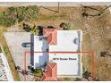 Aerial view of a home showcasing its expansive rooftop patio and well-manicured surroundings at 3074 Ocean Shore Blvd, Ormond Beach, FL 32176