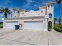 Charming two-story home featuring a two-car garage and well-maintained landscaping at 3074 Ocean Shore Blvd, Ormond Beach, FL 32176