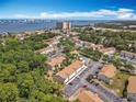 An aerial view of the community with a swimming pool and views of the city skyline and waterfront at 420 Banana Cay Dr # A, South Daytona, FL 32119