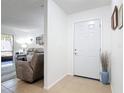 A welcoming entryway with tile flooring and a view into the adjacent living room space at 420 Banana Cay Dr # A, South Daytona, FL 32119