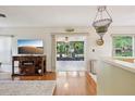 Comfortable living room with access to a screened patio and beautiful backyard views at 440 Champagne Cir, Port Orange, FL 32127
