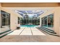 Spacious covered patio overlooking a screened-in pool area, ideal for outdoor living at 6 Talaquah Blvd, Ormond Beach, FL 32174