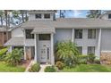 Inviting exterior of a townhome with a well-maintained yard and charming front entrance at 129 Golden Eye Dr # C, Daytona Beach, FL 32119