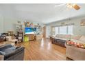 Spacious living room featuring laminate floors, comfortable seating and natural light at 24538 Wildhog Rd, Astor, FL 32102