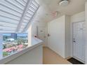 Bright hallway leading to the unit's entrance with a view of the city at 2937 S Atlantic Ave # 2001, Daytona Beach, FL 32118