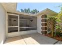 Cozy screened-in porch, perfect for enjoying the outdoors at 3119 Mango Tree Dr, Edgewater, FL 32141