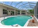 Inviting screened-in pool area, perfect for relaxation and outdoor entertaining at 69 Coquina Ridge Way, Ormond Beach, FL 32174