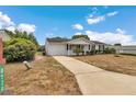 Cozy one-story home featuring an attached garage and tidy front yard at 8720 Sw 108Th Ln, Ocala, FL 34481