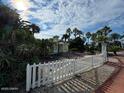 The entrance to the community offers lush landscaping, palm trees and colorful coastal architecture at 3000 Ocean Shore Blvd # 150, Ormond Beach, FL 32176