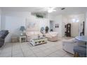 Bright living room with tile floors, neutral walls, and comfortable seating; perfect for relaxation at 4622 Secret River Trl, Port Orange, FL 32129