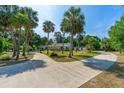 Beautiful home with circular driveway, lush landscaping, mature trees, and well-maintained grounds at 1159 Magnolia Ave, Daytona Beach, FL 32114