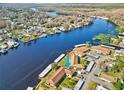 Gorgeous aerial view of the waterway highlighting the community's location and the boat docks available for residents at 1640 Juno Trl # 105D, Astor, FL 32102