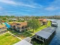 Charming waterfront condo with boat docks, screened in porch, and landscaping at 1640 Juno Trl # 105D, Astor, FL 32102