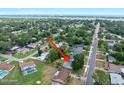 An aerial view of a residential area showcasing the neighborhood and surrounding landscape near the water at 241 Sanchez Ave, Ormond Beach, FL 32174