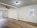 Bright living room featuring new vinyl flooring, neutral walls, recessed lighting, and a ceiling fan at 244 Oakleigh Dr # 200, Deland, FL 32724