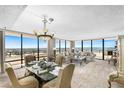 Bright living room with floor-to-ceiling windows and scenic views at 3743 S Atlantic Ave # 11D, Daytona Beach Shores, FL 32118