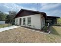 Charming single-story home with a screened porch and a newly landscaped yard at 486 S Us Highway 1, Oak Hill, FL 32759