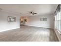 Bright and airy living room showcasing neutral wall paint, tile floors, and natural light from the windows at 991 Dawson Dr, Deltona, FL 32725