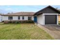 Charming one-story home with a well-maintained front yard and a one car garage at 1744 Valencia Ave, Ormond Beach, FL 32174