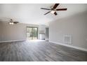 Open-concept living area with hardwood floors, stainless steel appliances, and lots of natural light at 1744 Valencia Ave, Ormond Beach, FL 32174