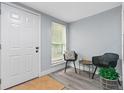 Inviting entryway with modern decor, featuring neutral walls and contemporary furniture at 603 W Miles St, Deland, FL 32720