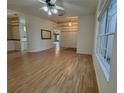 Open-concept living space featuring hardwood floors and modern lighting fixtures at 16 Hunt Master Ct, Ormond Beach, FL 32174