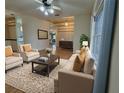 Stylish living room with comfortable seating, a decorative rug, and ample natural light at 16 Hunt Master Ct, Ormond Beach, FL 32174
