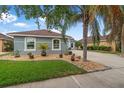 Attractive home with charming flowerbeds and a well-manicured lawn creates appealing curb appeal at 3345 Tesoro Cir, New Smyrna Beach, FL 32168
