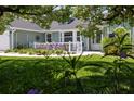 Quaint porch adorned with festive decorations and lush greenery at 516 Spotted Sandpiper Dr, Daytona Beach, FL 32119