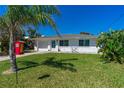 Beautiful home featuring lush greenery and a vibrant lawn, perfect for outdoor enjoyment at 129 Dundee Rd, Daytona Beach, FL 32118