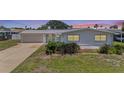 Charming single-story home featuring well-maintained lawn, an attached garage, and neutral paint scheme at 136 Reef Rd, South Daytona, FL 32119