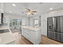 Bright, modern kitchen featuring stainless steel appliances, a center island, and lots of storage space at 136 Reef Rd, South Daytona, FL 32119