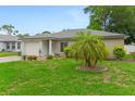 Attractive single-story brick house with a well-maintained lawn and mature landscaping at 1719 Anniston Ave, Daytona Beach, FL 32117