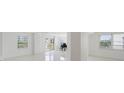 Bright and airy living room featuring white walls, tile floors, and natural light from multiple windows at 1 John Anderson Dr # 2180, Ormond Beach, FL 32176