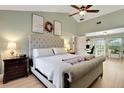 The primary bedroom boasts vaulted ceilings, hardwood floors, and a tranquil ambiance at 101 Green Heron Ct, Daytona Beach, FL 32119