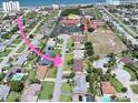 Aerial view of a residential area close to the beach with community buildings at 106 Banyan Dr, Ormond Beach, FL 32176