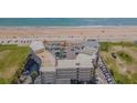 Aerial view of oceanfront property with pool, parking, and beach access at 1233 S Atlantic Ave # 3070, Daytona Beach, FL 32118