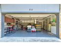 Spacious garage features ample storage, work benches, and epoxy flooring, offering a practical workspace at 35 Whippoorwill Ln, Ormond Beach, FL 32174