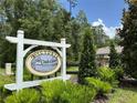 Sign for Victoria Oaks community in a natural setting with lush greenery at 551 Shaelyn Pl, Deland, FL 32724