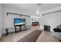 Open living room with tile floors, bright walls, and ample room for entertaining at 1333 E Lombardy Dr, Deltona, FL 32725